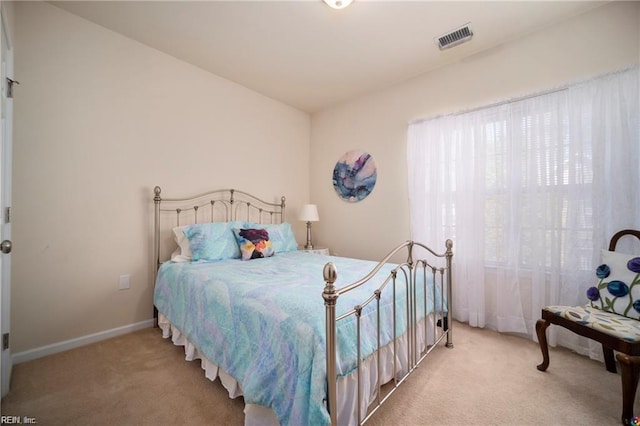 bedroom with light carpet