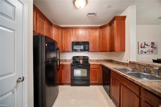 kitchen featuring sink and black appliances