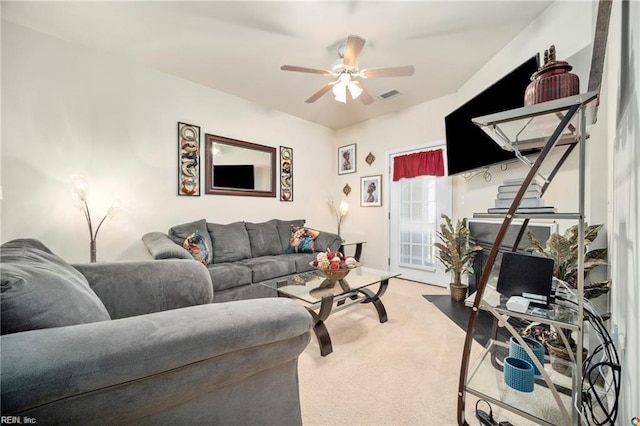 carpeted living room featuring ceiling fan