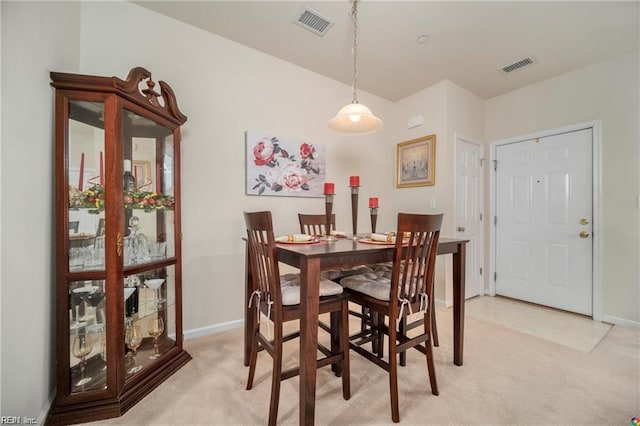 view of carpeted dining area