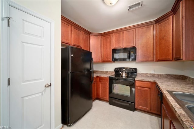 kitchen featuring black appliances and sink