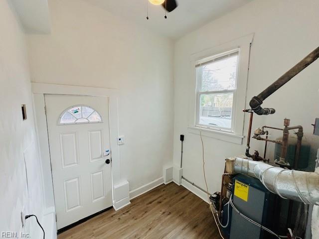 entryway with ceiling fan and wood-type flooring