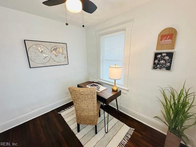 office space featuring ceiling fan, a wealth of natural light, and dark hardwood / wood-style floors