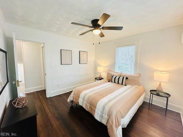 bedroom featuring ceiling fan and dark wood-type flooring