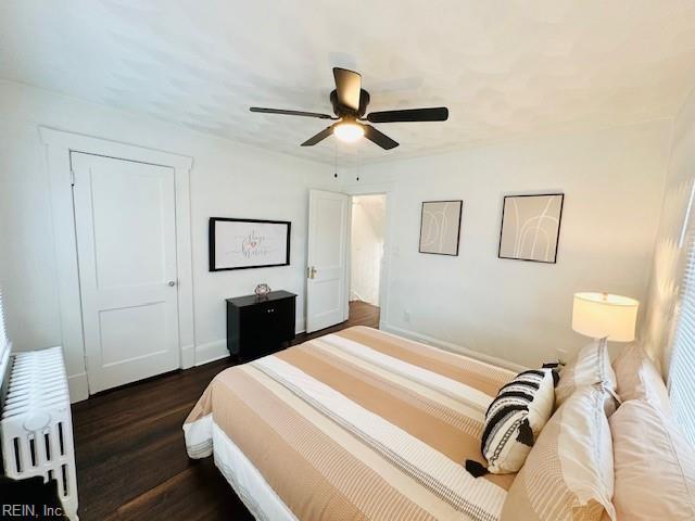 bedroom featuring dark wood-type flooring and ceiling fan