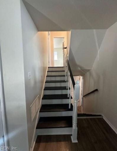 stairway featuring hardwood / wood-style floors