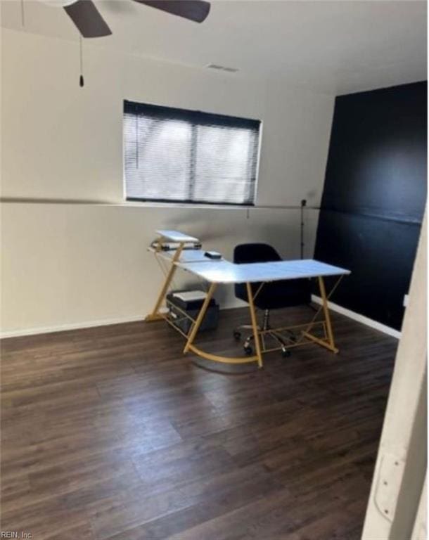 office featuring dark wood-type flooring and ceiling fan