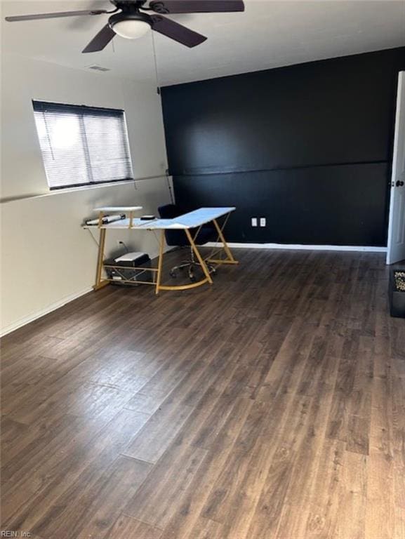 interior space featuring dark hardwood / wood-style floors and ceiling fan