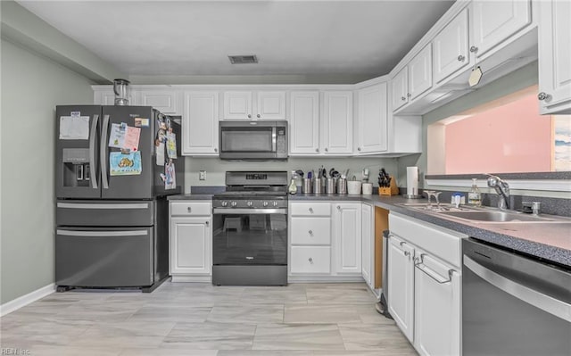 kitchen with white cabinets, sink, and stainless steel appliances