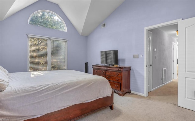 carpeted bedroom with vaulted ceiling