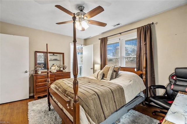 bedroom with ceiling fan and light hardwood / wood-style floors