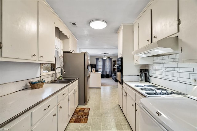 kitchen featuring white cabinets, sink, stainless steel fridge, white electric stovetop, and ceiling fan