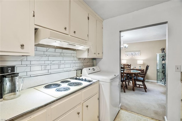 kitchen featuring white cabinetry, washer / clothes dryer, light carpet, and white electric stovetop