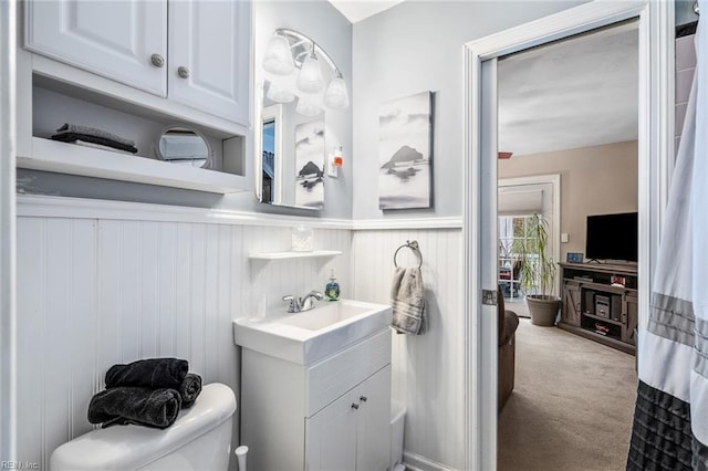 bathroom with toilet and vanity