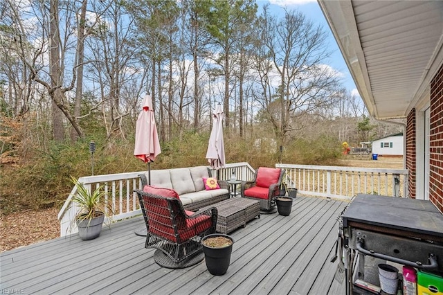 wooden terrace with outdoor lounge area