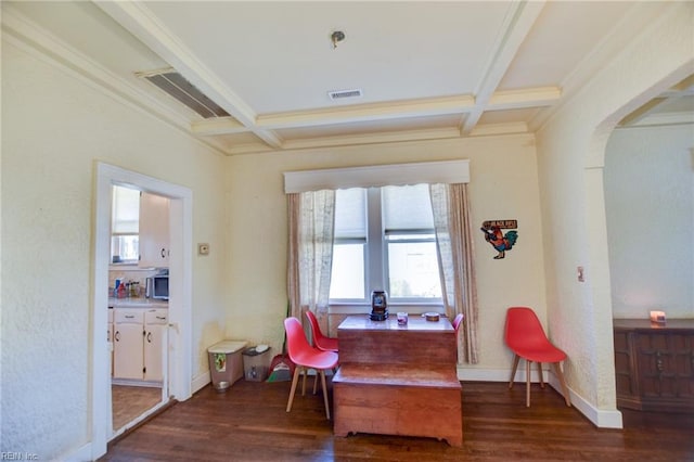 living area featuring dark wood-type flooring, crown molding, beam ceiling, and coffered ceiling