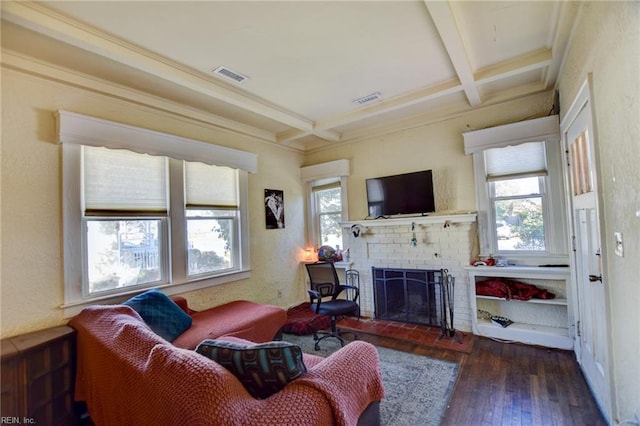 living room with a brick fireplace, dark hardwood / wood-style floors, beam ceiling, and coffered ceiling