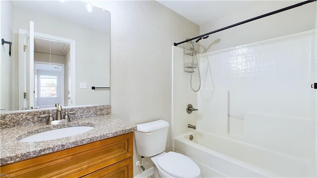 full bathroom featuring toilet, vanity, and bathing tub / shower combination