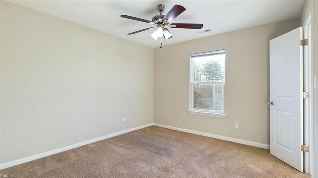 unfurnished room with ceiling fan and light colored carpet