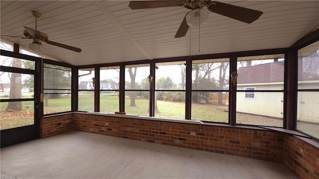 unfurnished sunroom featuring vaulted ceiling and ceiling fan