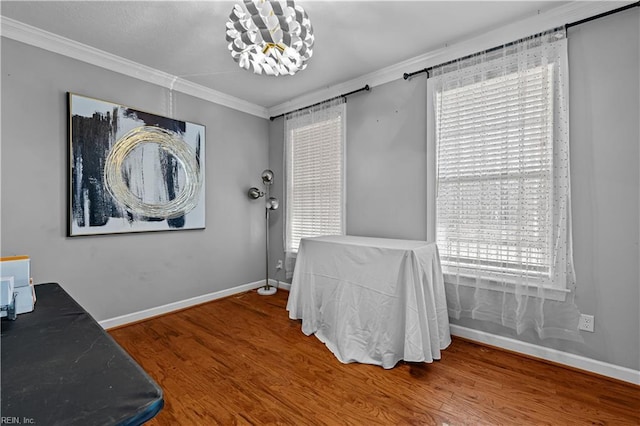 home office featuring hardwood / wood-style flooring and ornamental molding