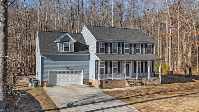 view of front of property with a porch and a garage