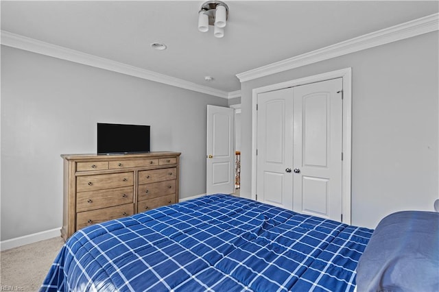 bedroom featuring a closet, carpet, and ornamental molding