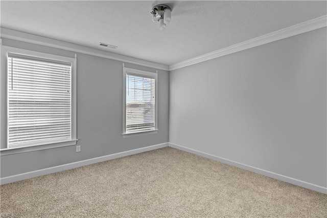 unfurnished room with crown molding and carpet flooring