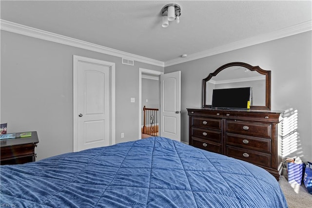 carpeted bedroom featuring ornamental molding