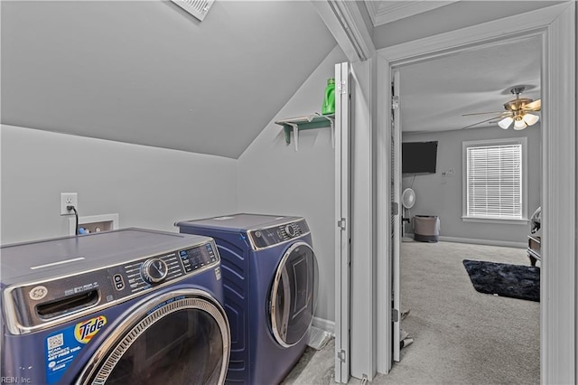 laundry area with washing machine and dryer, ceiling fan, and light carpet