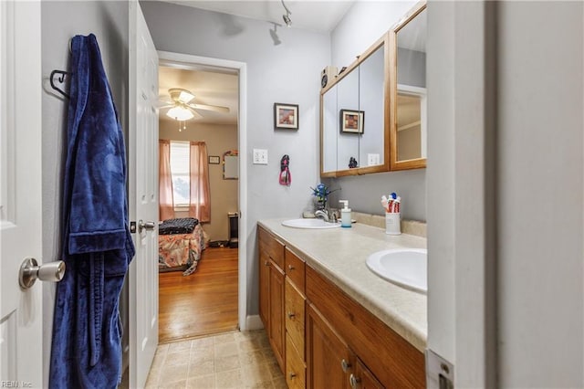 bathroom with ceiling fan and vanity