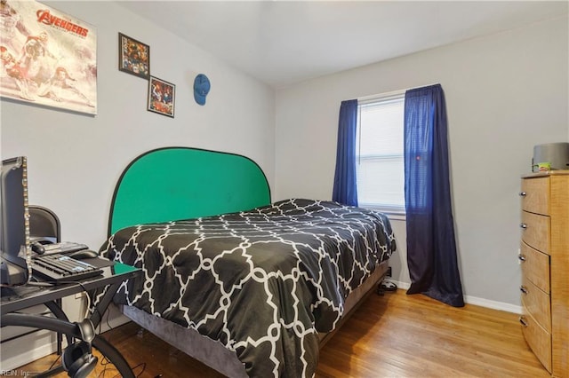 bedroom with wood-type flooring