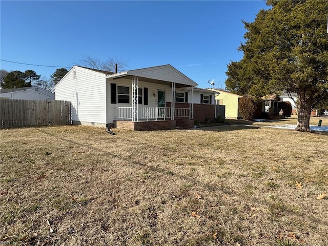 single story home featuring a front lawn and covered porch