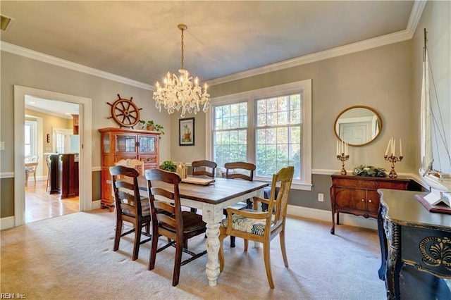 dining space featuring an inviting chandelier, crown molding, and light colored carpet