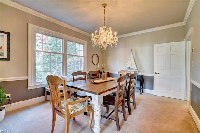 carpeted dining area with crown molding and an inviting chandelier