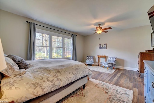 bedroom with hardwood / wood-style floors and ceiling fan