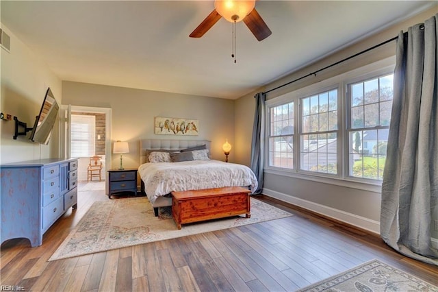 bedroom featuring ceiling fan and light hardwood / wood-style floors