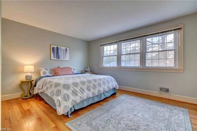 bedroom with light wood-type flooring