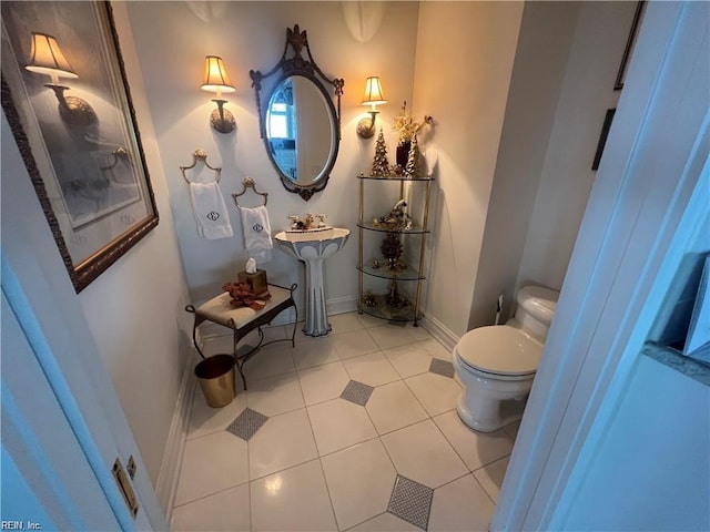 bathroom featuring toilet and tile patterned floors