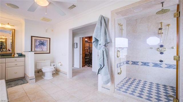 bathroom featuring vanity, toilet, crown molding, and an enclosed shower