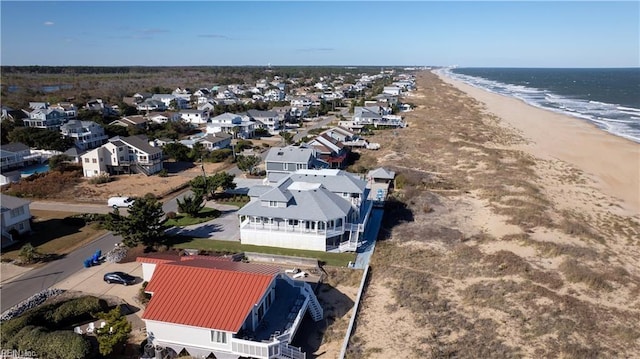 bird's eye view featuring a water view and a view of the beach