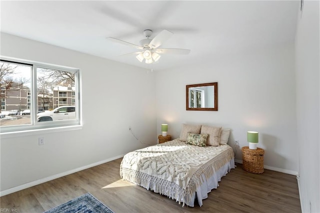 bedroom featuring ceiling fan and wood-type flooring