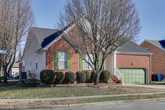 view of front of home featuring a garage, a front yard, and central AC unit