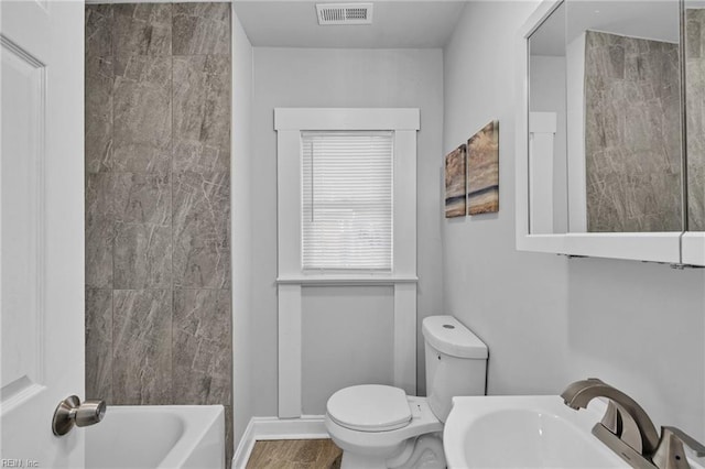 full bathroom with toilet, bathtub / shower combination, and sink