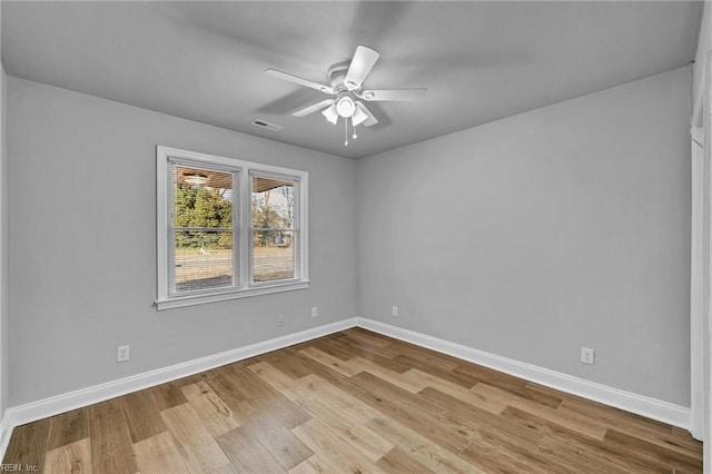 unfurnished room with ceiling fan and light hardwood / wood-style floors