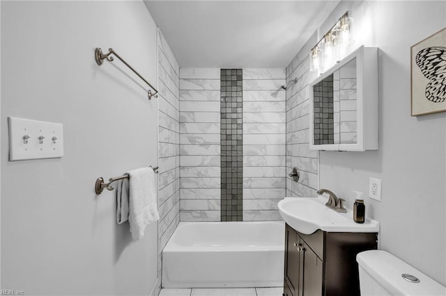 full bathroom with toilet, vanity, tiled shower / bath, and tile patterned flooring