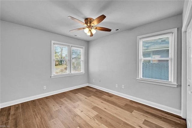 spare room with ceiling fan and light hardwood / wood-style flooring