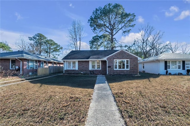 single story home with a front lawn