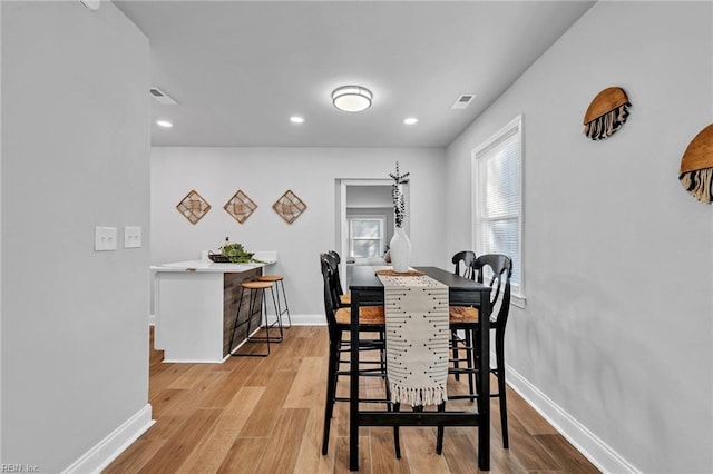 dining area with light wood-type flooring