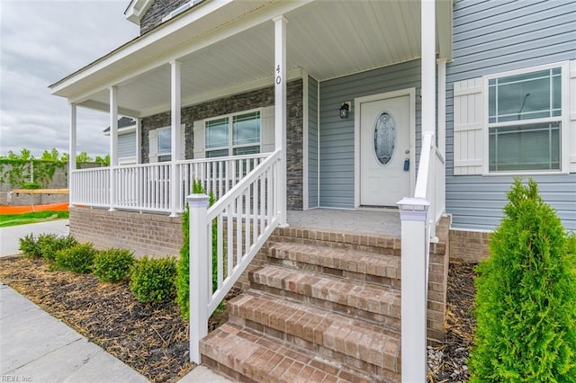 doorway to property featuring a porch